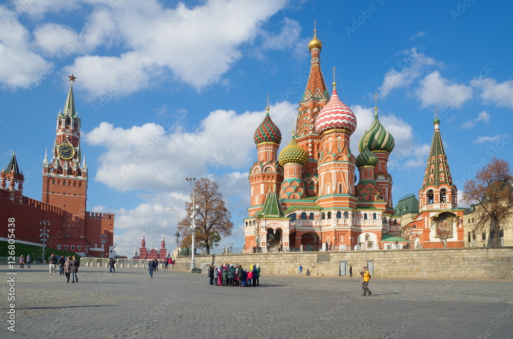 Moscow, Russia - October 24, 2016: The View of the Pokrovsky Cathedral (Temple of Basil the blessed) and the Spassky tower of the Moscow Kremlin