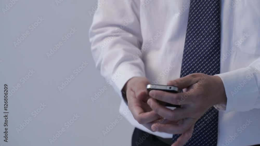 CU TU Businessman dialing number and talking on cell phone