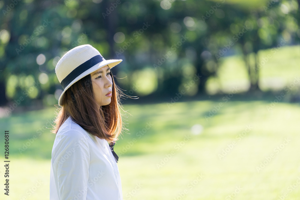 Young woman in contemplative mood looking to side. thinking something.