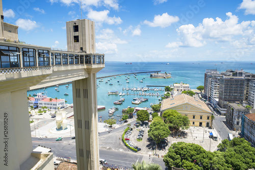 Scenic city skyline view of Salvador, Brazil with Lacerda Elevator, Bay of All Saints, and old Lower City architecture on the horizon