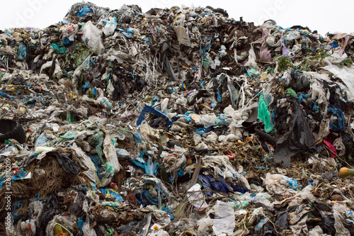 Pile of plastic bags and other refined petroleum products dumped in landfill. Garbage heap gives infiltrate into ground. Waste sorting is required. Lviv city