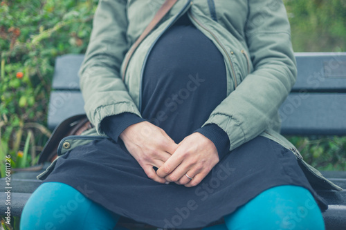Pregnant woman on bench