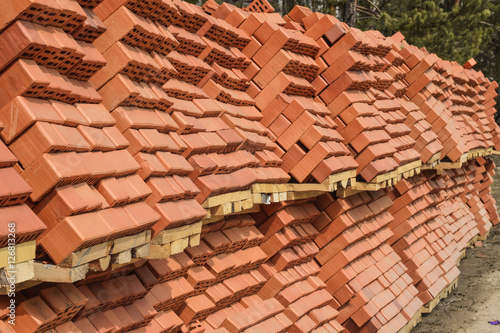 Obraz w ramie Red bricks lying at a construction site .