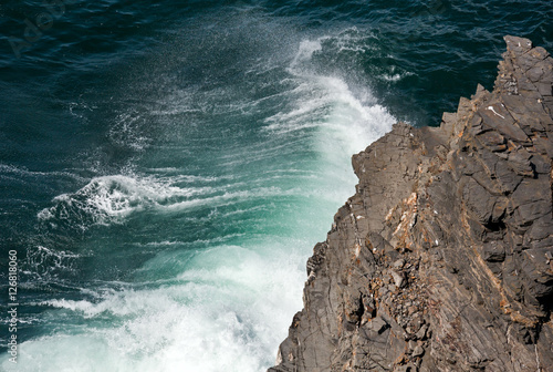 Waves breaking on rocky coast.