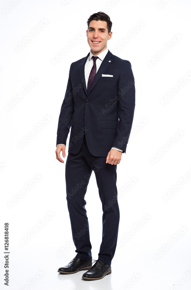 Young handsome man posing in studio wearing fashionable suit Young handsome man posing in studio wearing fashionable suit