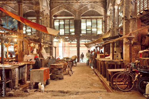 End of working day inside of grunge hall of old city market with historical counters