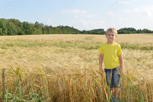 little boy in field © Denis Tabler