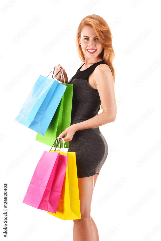 Young woman with shopping bags isolated on white Young woman with shopping bags isolated on white