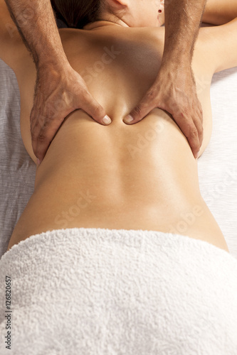 Slika na platnu young woman enjoys back massage