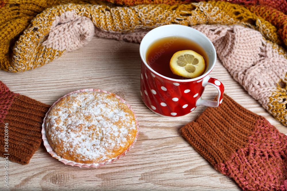 muffins with tea cup on wooden table muffins with tea cup on wooden table