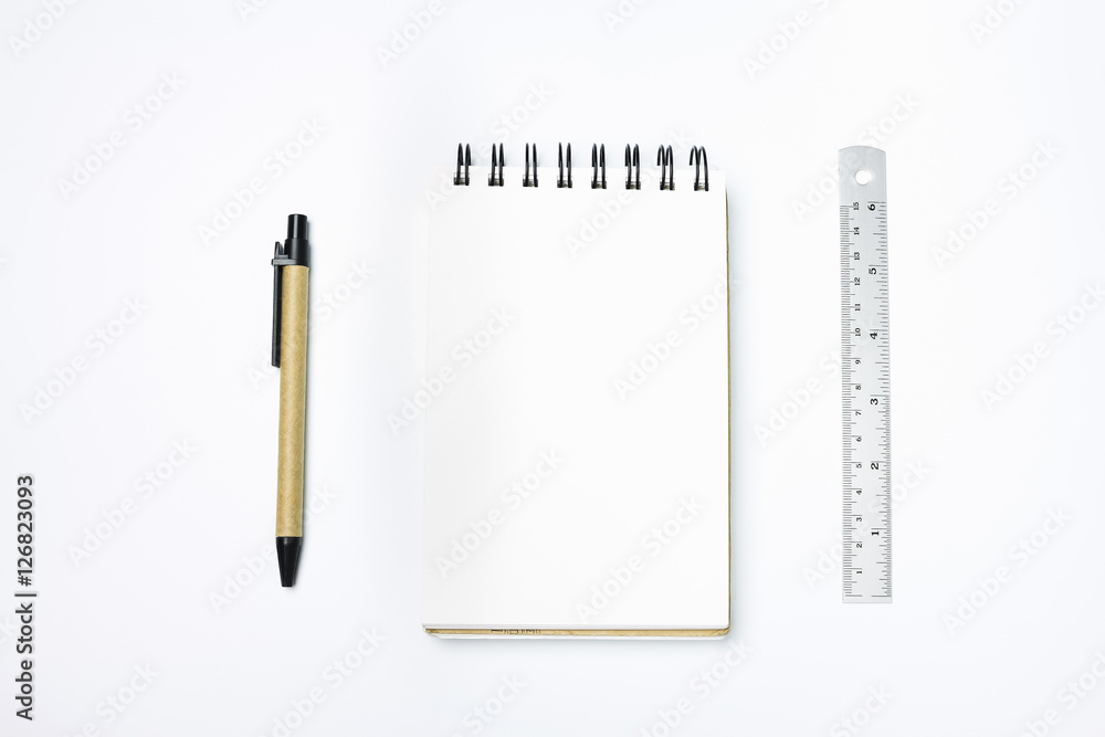 White designer office desk table with blank paper with pen, ruler. Top view, flat lay. White designer office desk table with blank paper with pen, ruler. Top view, flat lay.