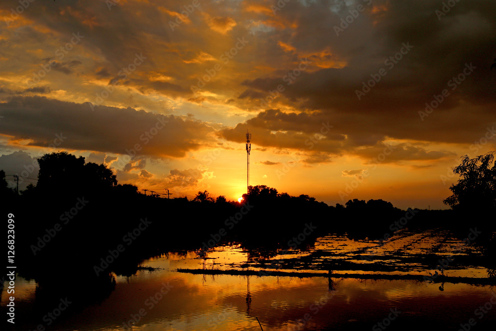 Communications tower with a beautiful sunset sky Communications tower with a beautiful sunset sky