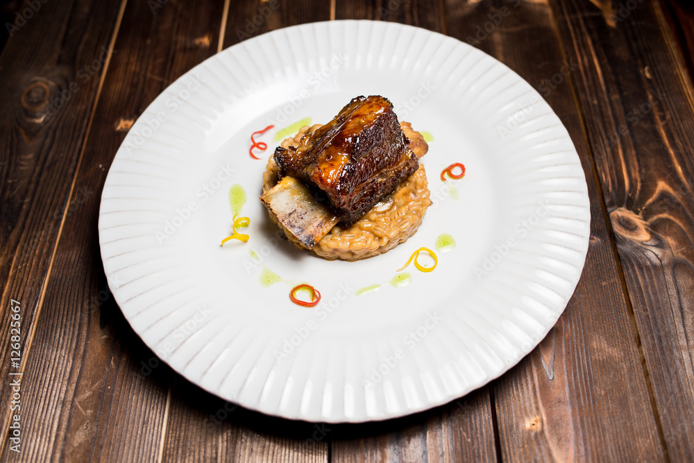 beef ribs on a bed of oatmeal