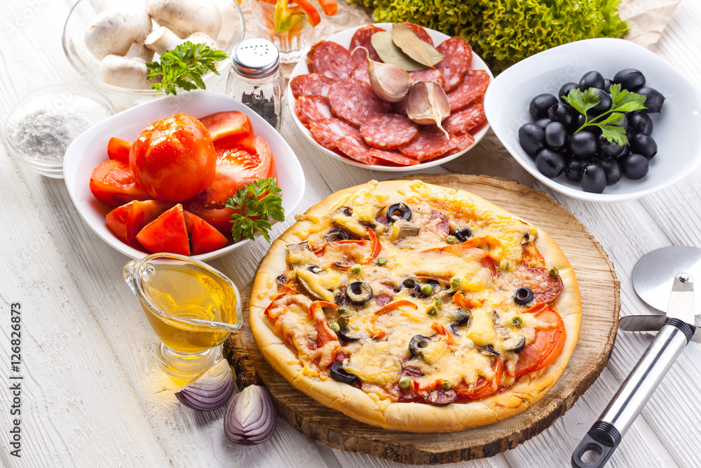 Delicious italian pizza served on wooden table Delicious italian pizza served on wooden table