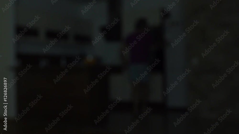 Blurred man opening refrigerator at night. Gluttony, diet or weight gain concepts. 4K bokeh video Blurred man opening refrigerator at night. Gluttony, diet or weight gain concepts. 4K bokeh video