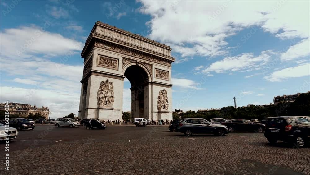 Triumphal arch. Paris. France. Static camera, real time. Place Charles de Gaulle. Famous touristic architecture landmark. Symbol of french glory. World historical heritage. Day traffic. Toned