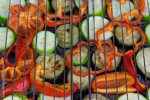 roasted vegetables on the grill as a background