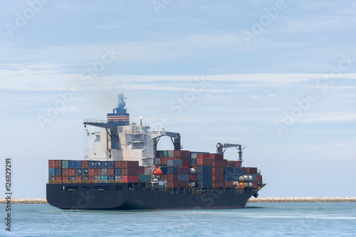 Logistics and transportation of cargo freight ship and cargo container for logistics and transportation background.