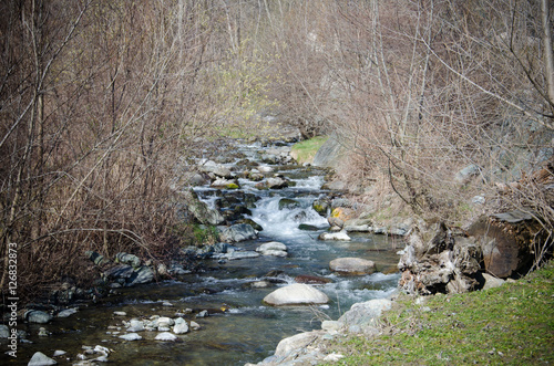 View of mountain river in early spring, in Italy