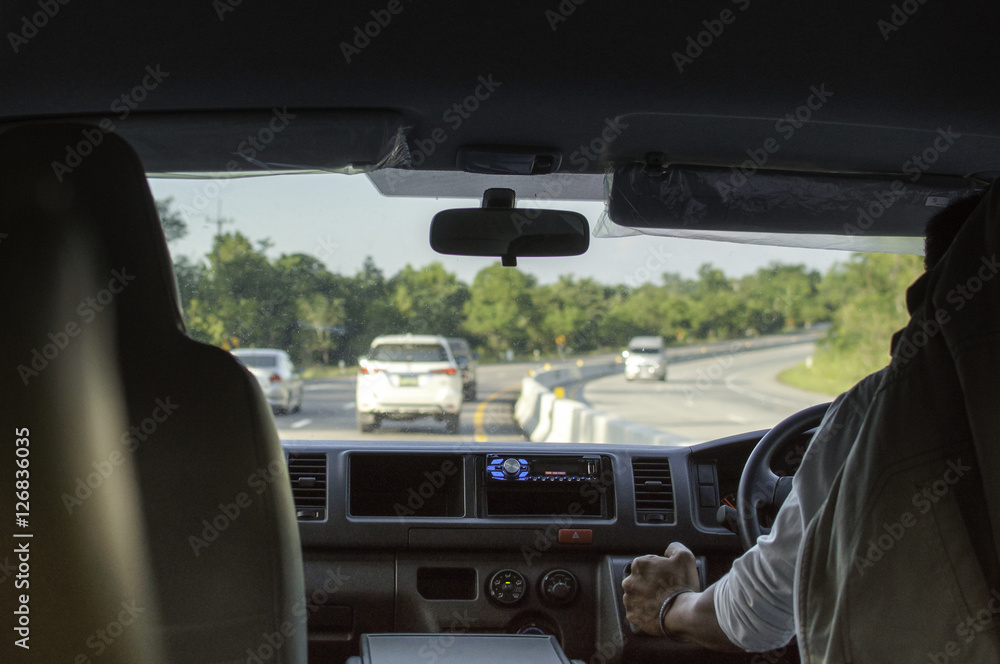 Hands of a driver on gear shift, he driving a minivan Hands of a driver on gear shift, he driving a minivan
