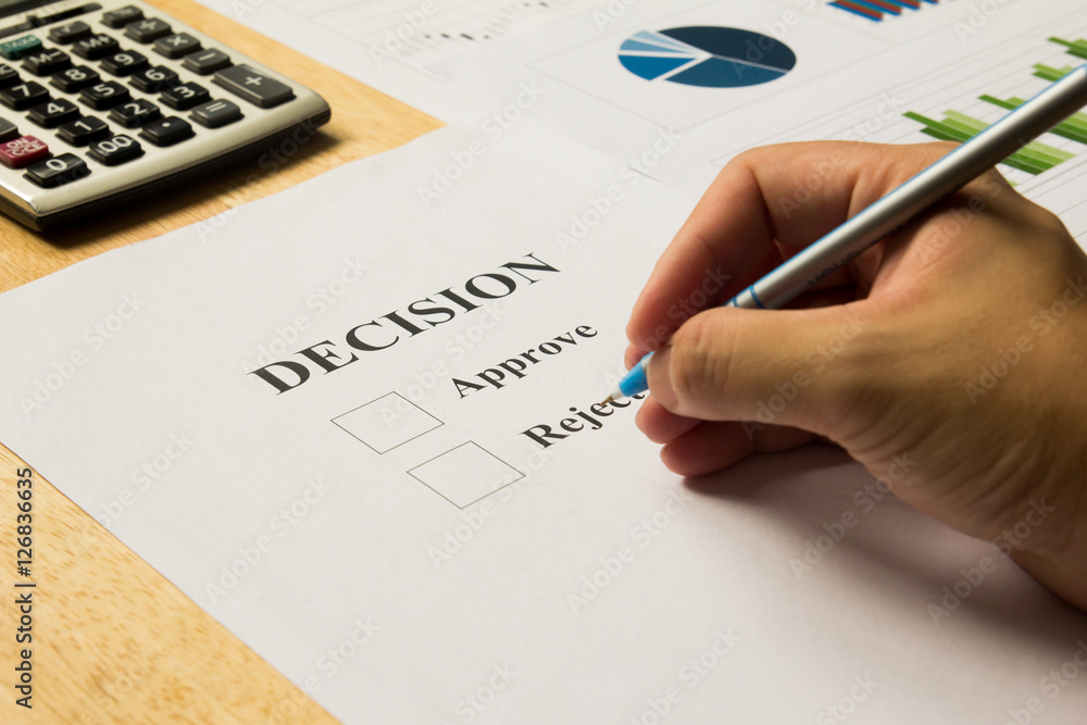 Businessman hold pen for approve and reject decision Businessman hold pen for approve and reject decision