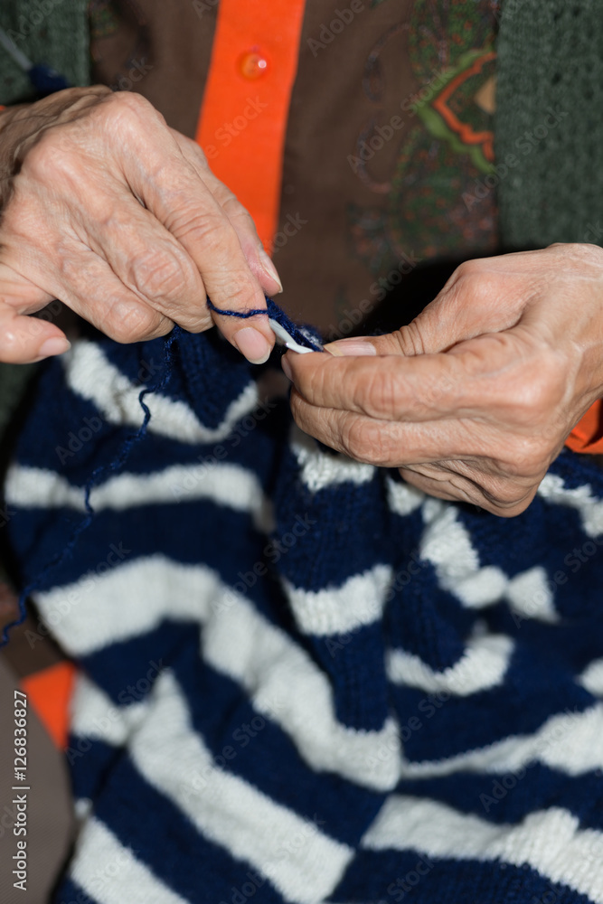 Detail of a person knitting Detail of a person knitting