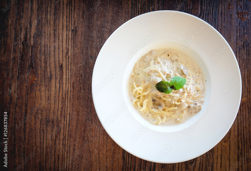 Close up of Spaghetti cream sauce tuna and mushroom in soft vintage tone and copyspace.