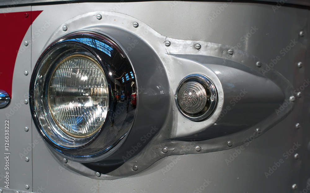 Close-up view of retro bus headlight. Close-up view of retro bus headlight.
