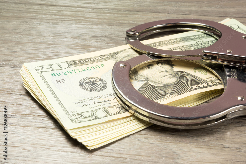 Dollar Bargeld und Handschellen Dollar Bargeld und Handschellen