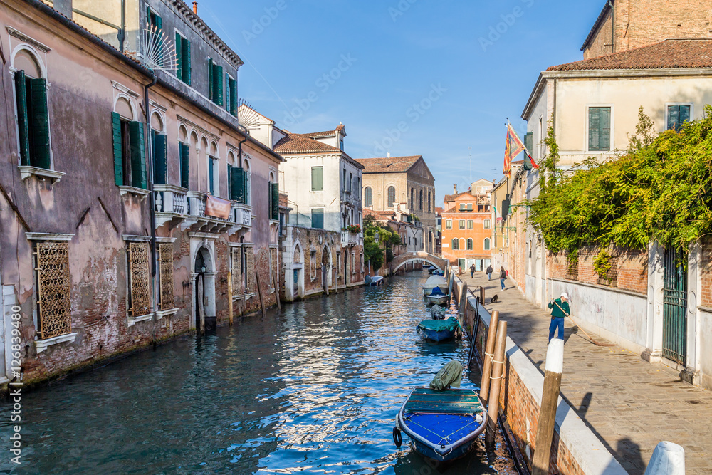 Streetview with bridge and old buildings in Venice Italy.