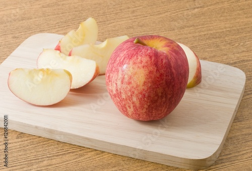 Ripe Red Apple on A Wooden Tray