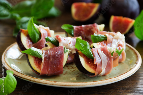 Appetizer of figs and prosciutto.