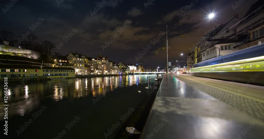 Zurich, Switzerland - river Limmat and Limmat Quai at night with clouds - Timelapse with zoom in Zurich, Switzerland - river Limmat and Limmat Quai at night with clouds - Timelapse with zoom in