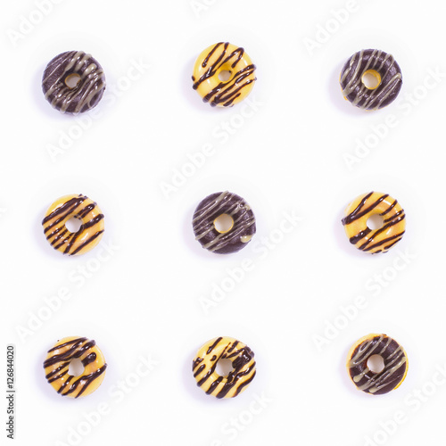 Nine Glased Donuts on the white background. Top view.