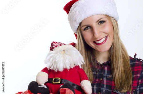 Happy smiley girl with plush Santa Claus, closuep photo