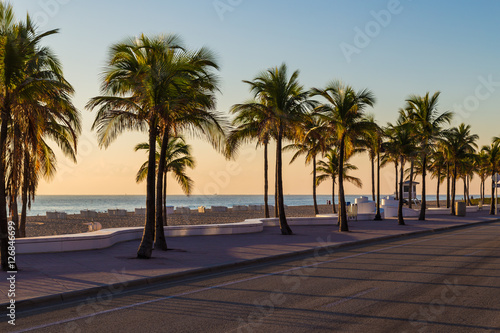Palm trees at tropical beach/Palm Trees silhouettes and golden sky background. © Satoshi Kina
