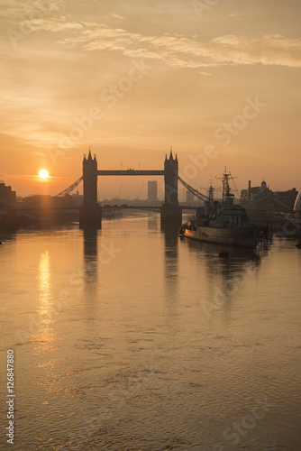 Golden Autumn sunrise over Tower Bridge in London.