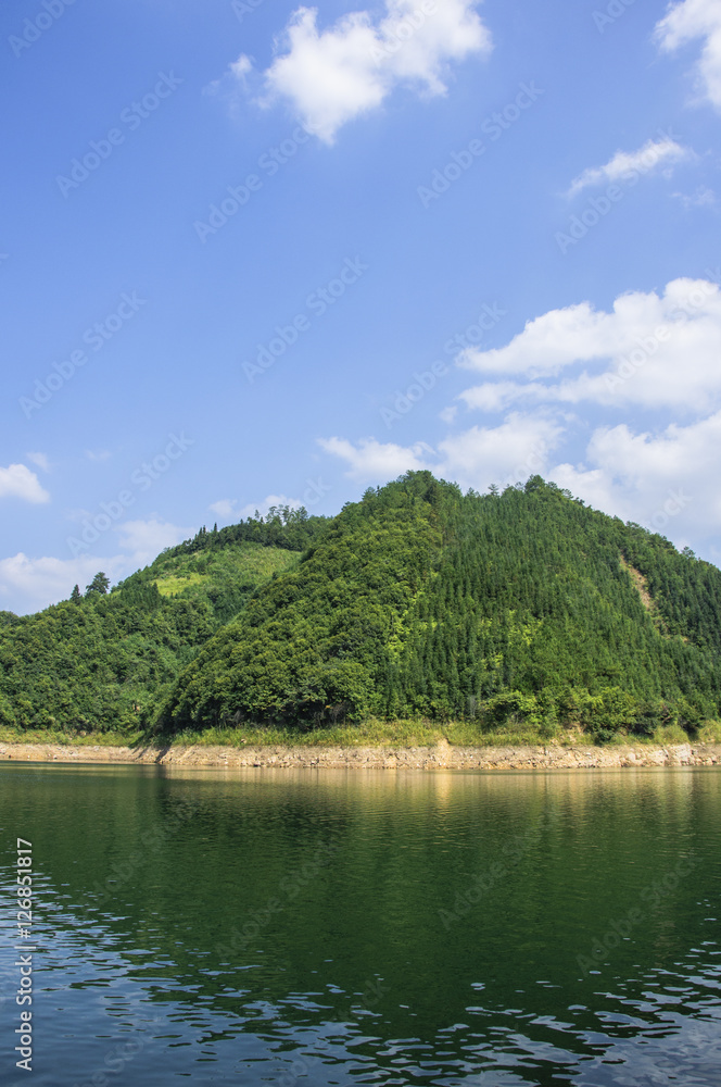 The lake and mountains scenery with blue sky The lake and mountains scenery with blue sky