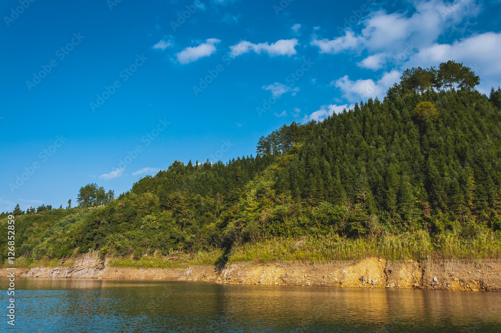 The lake and mountains scenery with blue sky The lake and mountains scenery with blue sky