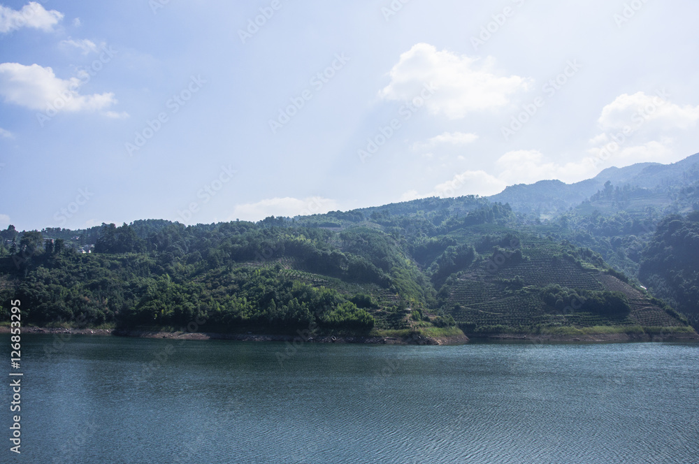 The lake and mountains scenery with blue sky The lake and mountains scenery with blue sky