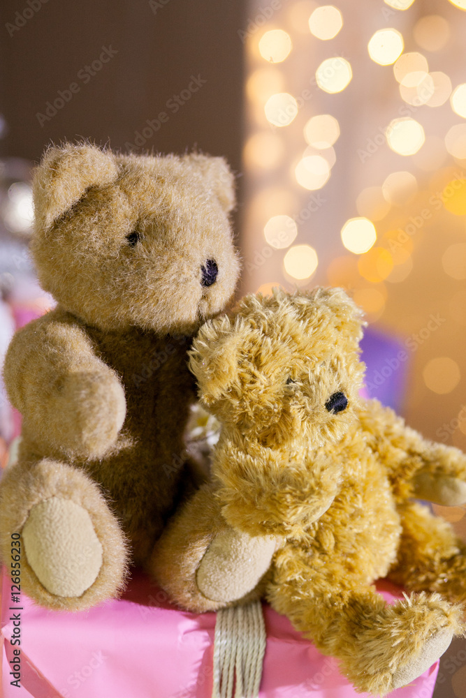 bear toy with gifts on the background of Christmas lights bear toy with gifts on the background of Christmas lights