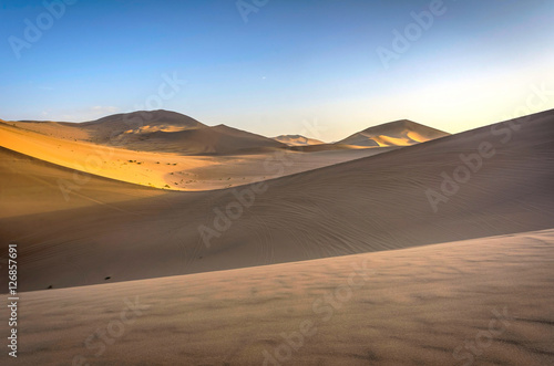 Colorful sand dunes in Gobi desert at sunset, Dunhuang, China