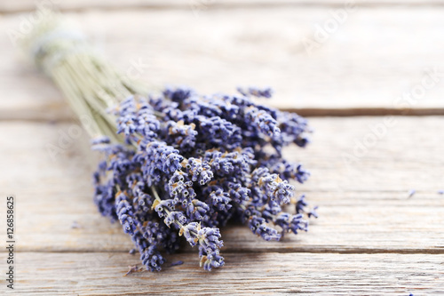 Fototapeta Naklejka Na Ścianę i Meble -  Bunch of lavender flowers on grey wooden background