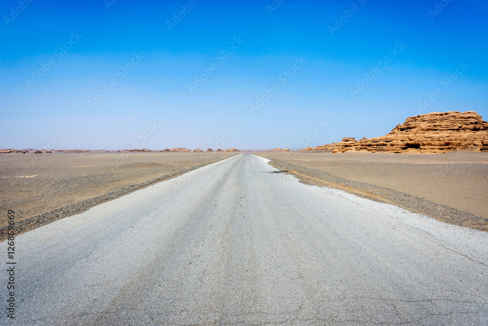 Road straight ahead to Dunhuang Yardang National Geopark, Gobi desert, China