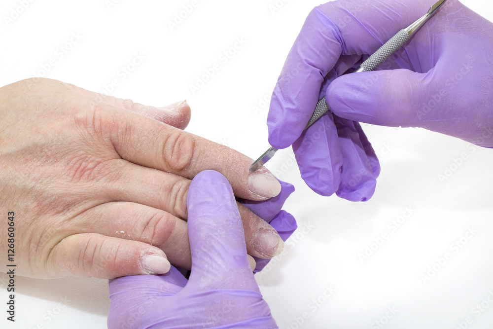 Woman doing manicure beauty salon varnish wellness Woman doing manicure beauty salon varnish wellness