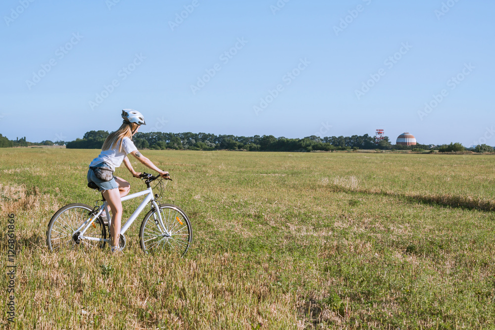 Picture of Young woman ride bicycle