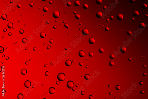 Background from drops of the different size on red glass