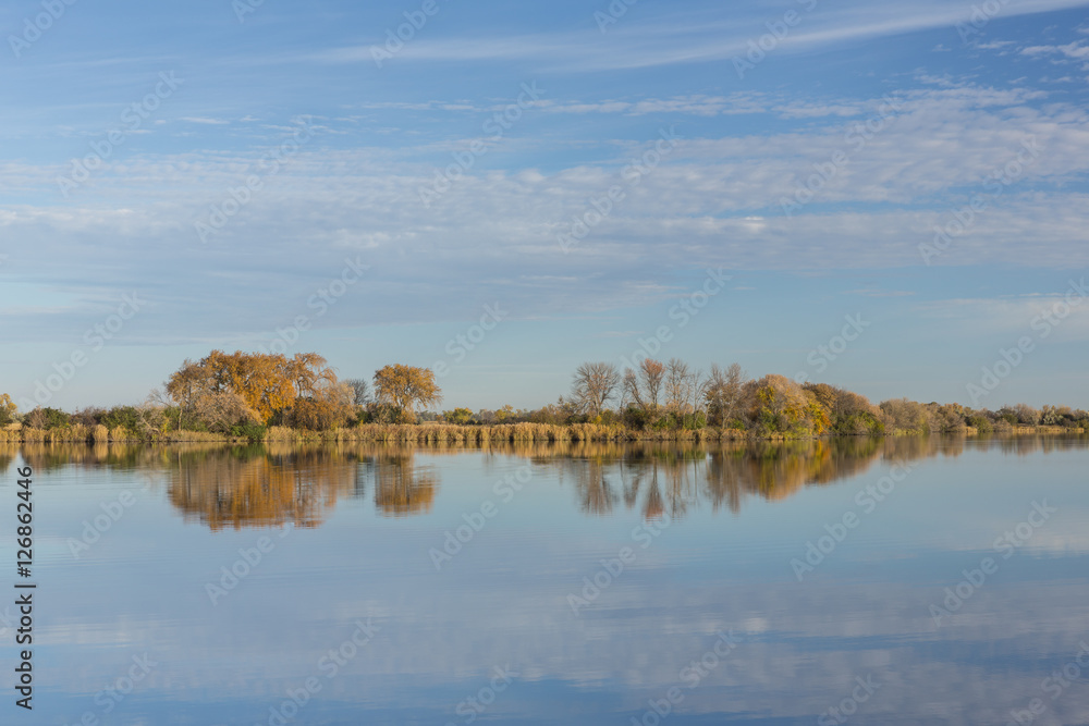Reflective Lake In Autumn