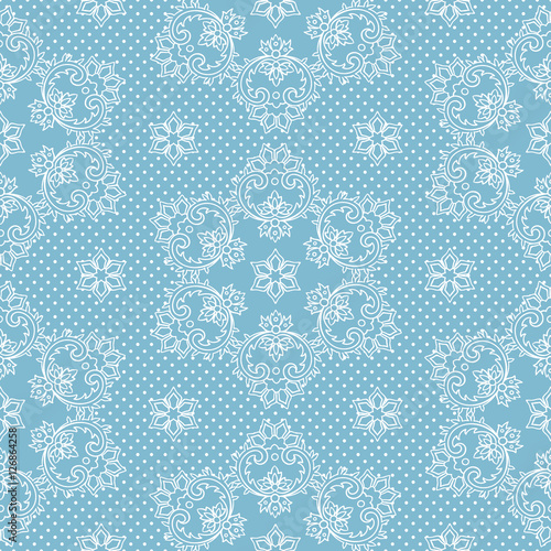 Seamless pattern snowflakes and polka dots on blue background vector. Christmas lace fabric or wrapping paper design illustration