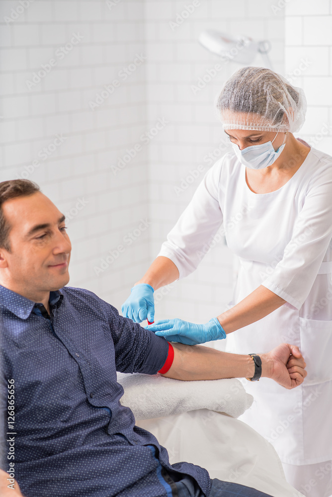 Middle-aged man preparing for blood-test